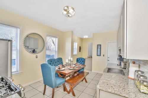 a kitchen and dining room with a table and chairs at Comfort Stay in Boston
