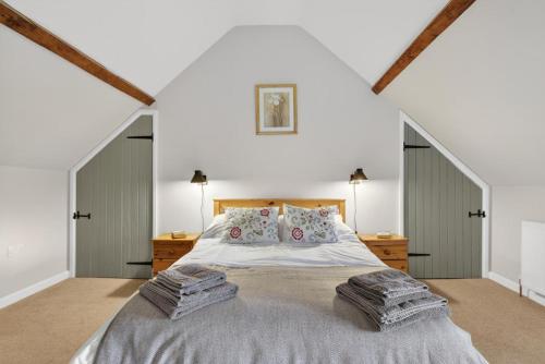 a bedroom with a large bed in a attic at 2 Bed in Taunton oc-conco in West Monkton