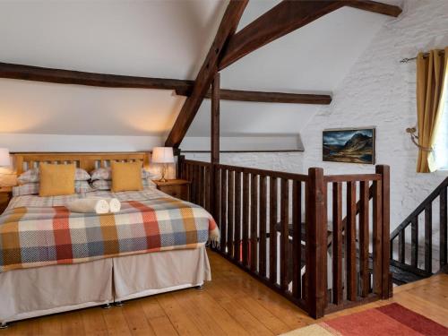 a bedroom with a king sized bed in a attic at 1 Bed in Brecon oc-bn336 in Talgarth