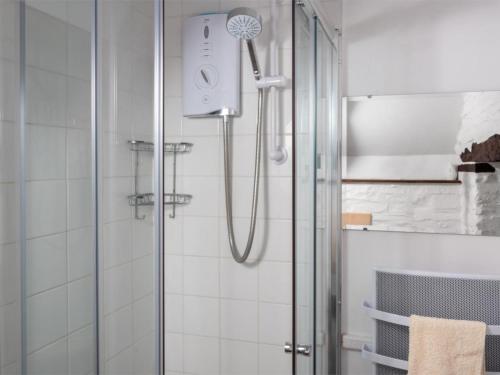 a shower with a shower head in a bathroom at 1 Bed in Brecon oc-bn336 in Talgarth