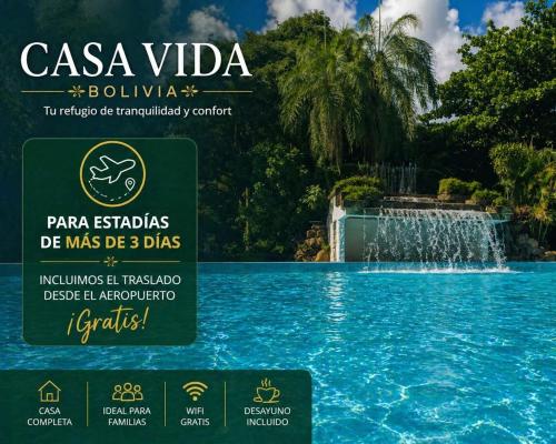 a sign in front of a fountain in a pool at Casa Vida - Arte, Naturaleza y Confort in Santa Cruz de la Sierra