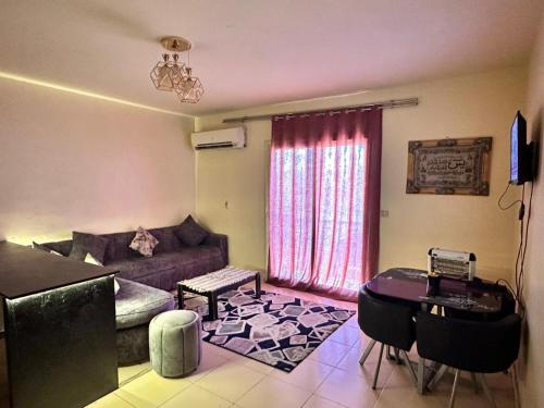 a living room with a couch and a table at Lasirena in Ain Sokhna