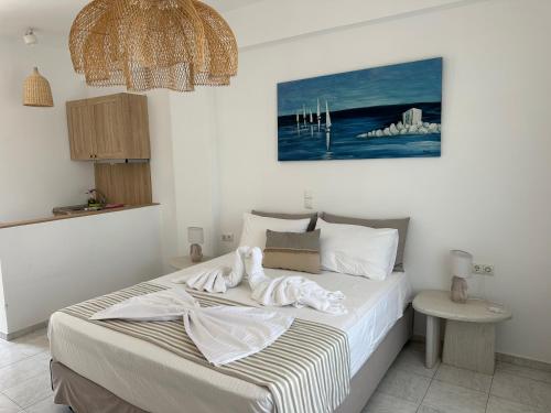 เตียงในห้องที่ Dedes Apartments