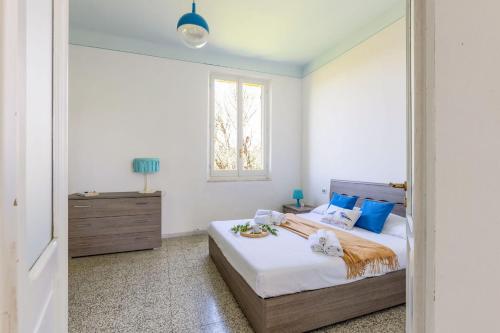a bedroom with a bed and a window at Italian Experience-Casale Oleandro Marino in Porto Recanati