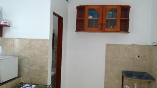 a bathroom with a cabinet on the wall at Residencial Dom Luiz in Belém