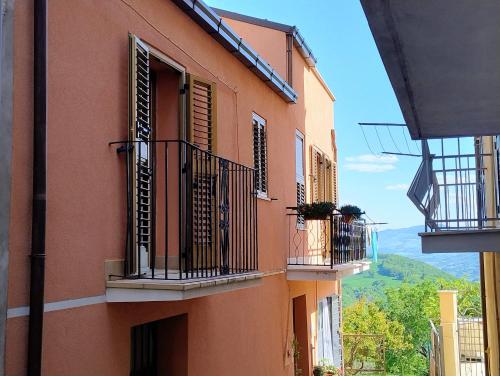 a building with balconies and windows with a view at Casa di Marie in Mafalda
