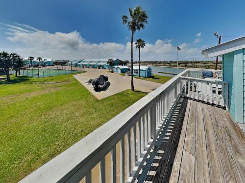 a view of the beach from the balcony of a house at Kontiki Bayfront Condo #710 in Rockport