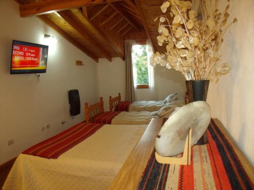 Cama ou camas em um quarto em Colibrí House