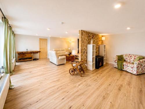 a living room with a couch and a table at Ferienwohnung Resi´s Welfenoase in Schwangau