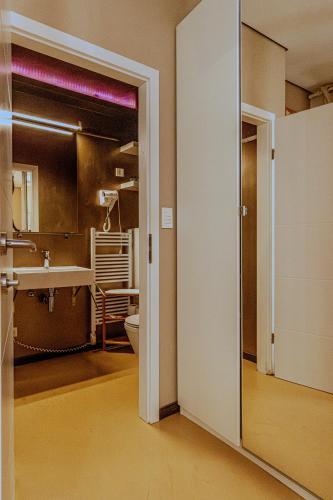 a bathroom with a toilet and a sink at Tre Porte Rooms & Bar in Rovinj