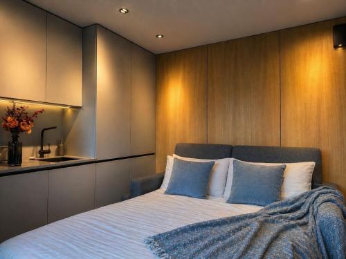 a bedroom with a large bed and a sink at Casa Luba in Saulkrasti