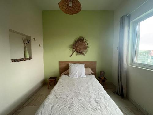 a bedroom with a bed and a window at Casa Tota in Assomada