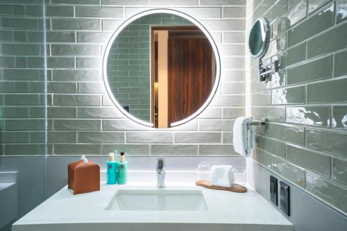 a bathroom with a sink and a mirror at Ambulan Mexico City in Mexico City