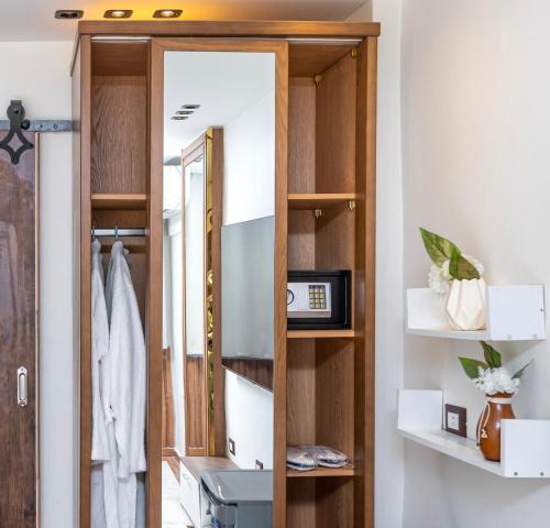a bathroom with a mirror and a sink at Shiny Pyramids Boutique Hotel in Cairo