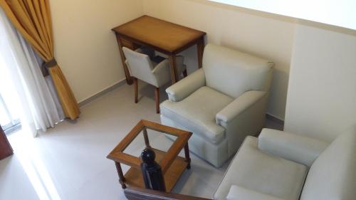 an overhead view of a room with chairs and a table at Tritone Hotel in Buenos Aires