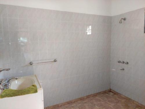 a bathroom with a sink and a shower at Casa Fauna in Mendiolaza