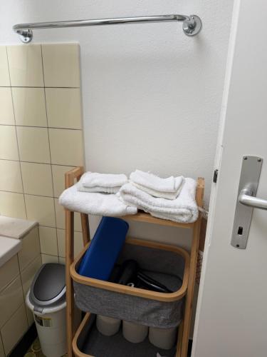 a bathroom with a table with towels on it at Mountain and Lake in Bönigen