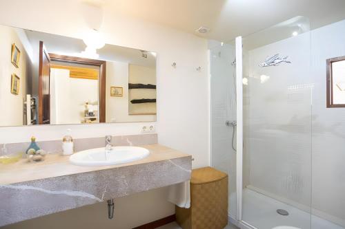 a bathroom with a sink and a shower at Ca Sa Padrina in Artá