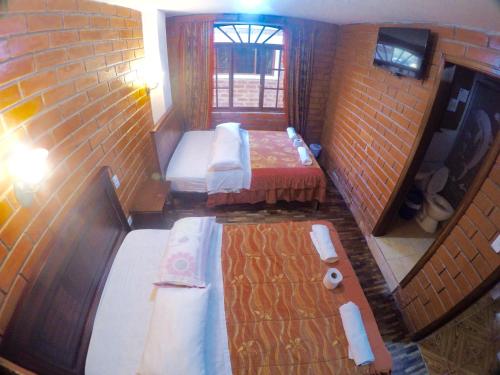 Ein Bett oder Betten in einem Zimmer der Unterkunft Hostal Nomada