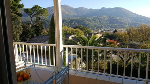 a balcony with a view of a mountain at Villa La Lézardière in Nyons