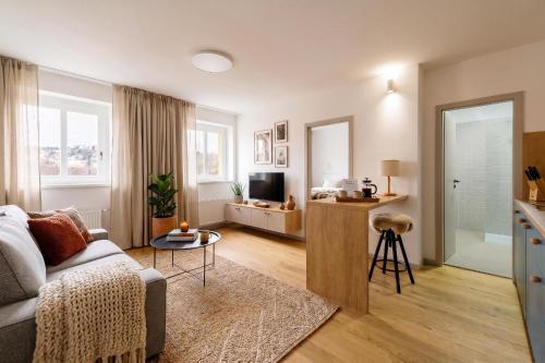 a living room with a couch and a table at Villa Šanca in Bratislava