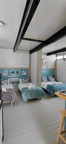 a room with four beds in a room with at Villa Palma in Marbella