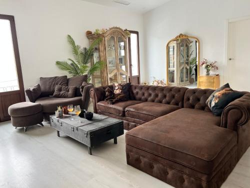 a living room with a couch and a coffee table at Casa de la luz in Cartagena