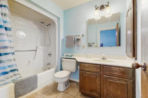 a bathroom with a toilet and a sink and a shower at Aspenwood 4229-30 in Pagosa Springs