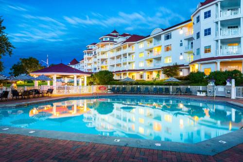 a large swimming pool in front of a hotel at Inn at Bay Harbor in Petoskey