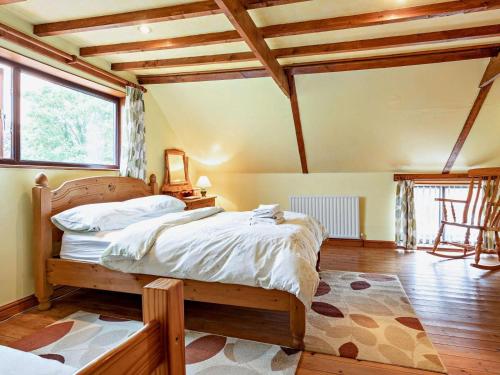 a bedroom with a bed and a large window at 2 Bed in Spalding oc-83540 in Donington