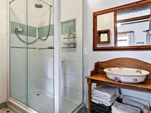 a bathroom with a glass shower and a sink at 2 Bed in Spalding oc-83540 in Donington