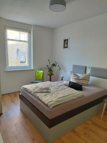 a bedroom with a large bed in a room at Altes Forsthaus Zwenkau in Zwenkau