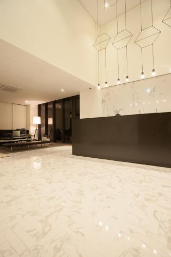 a large room with a marble floor and a lobby at Hotel Gaden in Suwon