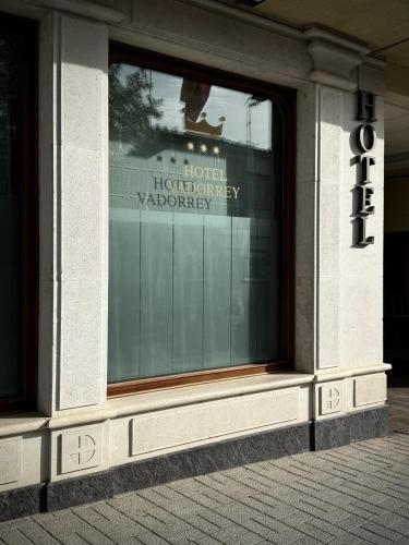 a window in a building with a sign in it at Hotel Vadorrey in Roa
