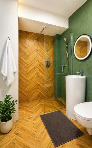 a bathroom with a shower and a toilet at Arena Park in Bucharest