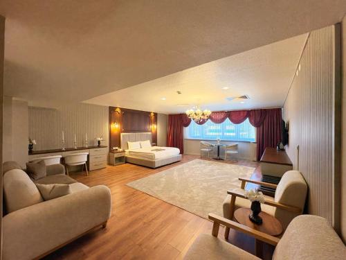 a large living room with a couch and a living room with at Volonte Hotel & Spa in Bahçelievler