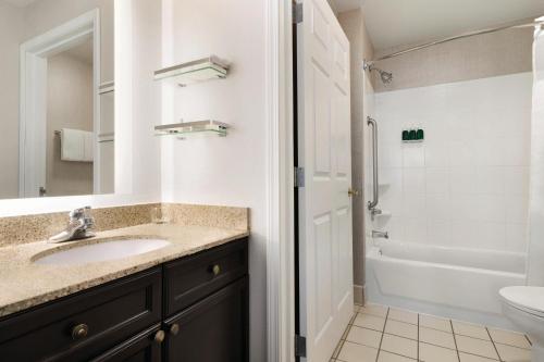 a bathroom with a sink and a toilet at Residence Inn by Marriott El Paso in El Paso
