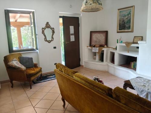a living room with a couch and two chairs at Casa Radiosa in Sora