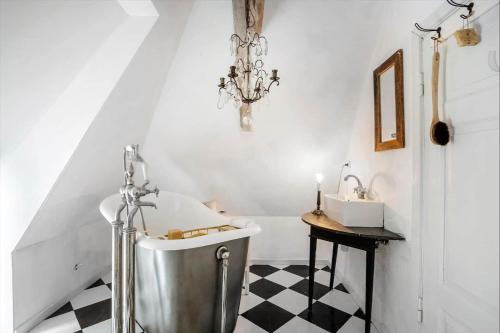a bathroom with a bath tub and a sink at AE326-Marstal-Pers-Bro-6 in Marstal