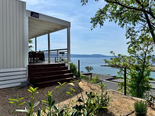 a building with stairs and a view of the water at Adriastay 360 in Klenovica