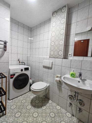 a small bathroom with a toilet and a sink at Ferienwohnung Unterkunft 24 in Aldingen