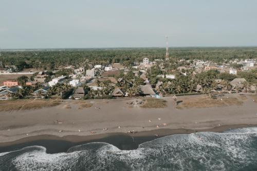 an aerial view of a beach with a resort at Cocorí Lodge Paredón in El Paredón Buena Vista