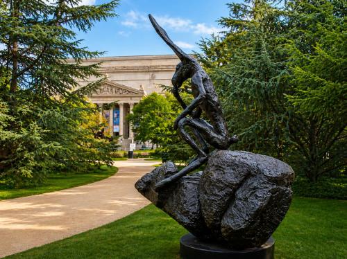 a statue of a woman on a rock in front of a building at Hala DC in Washington, D.C.