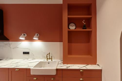 a bathroom with a sink and a counter at Karma Rooms in Ternopil
