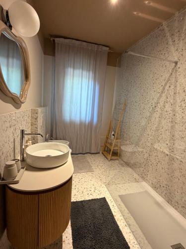 a bathroom with a sink and a bath tub at Perla del Mare in Cesenatico