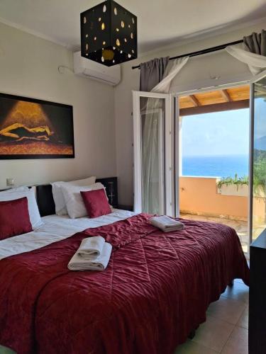 a bedroom with a large bed with a large window at Green Hill Resort in Pelekas