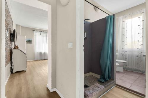 a bathroom with a shower and a toilet in a room at La Locanda Del Molino in Fortunago
