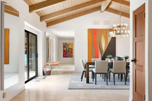 a dining room with a table and chairs at Desert Solstice in Palm Springs