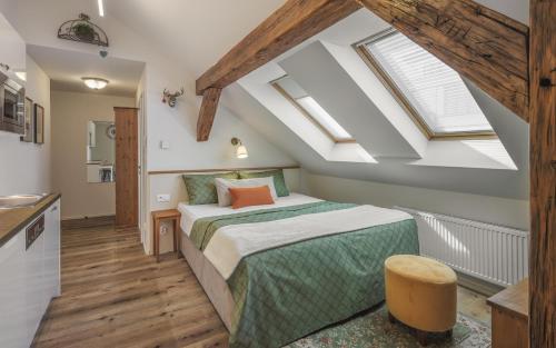 a bedroom with a large bed in a attic at SeNo6 Apartments in Prague