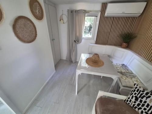 a living room with a table and a couch at Chalet de la Source in Casanova